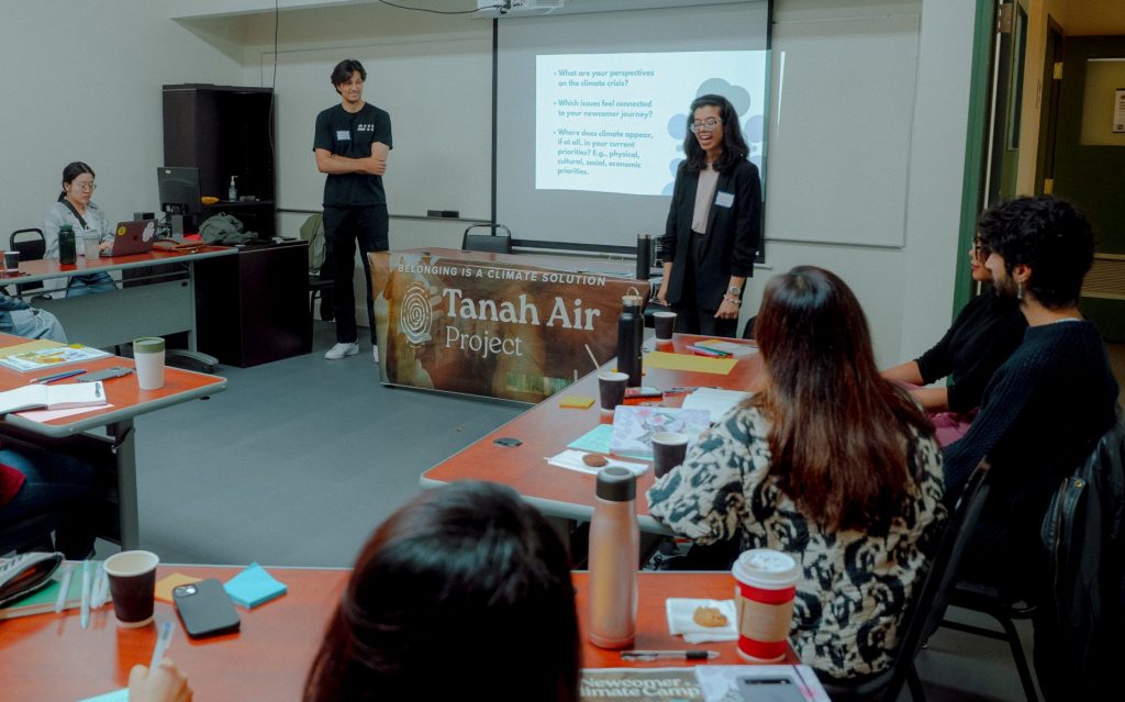 Divija Madhani facilitating a community engagement workshop on climate and mental health for newcomers.